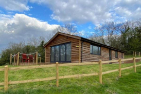 Log Cabin with View of the Malvern Hills